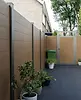 modern-yard-teak-composite-fence-scene-005.webp