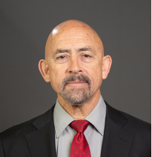 Man in suit with red tie.