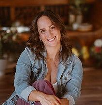 Dori Lewis sits smiling.