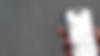 iPhone 16 mockup in a woman's hand with concrete backdrop (Mockuuups Studio) (2).png