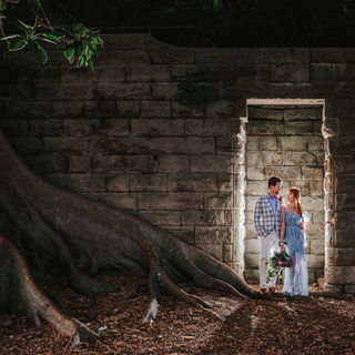 Elopement photography of couple framed by a doorway.