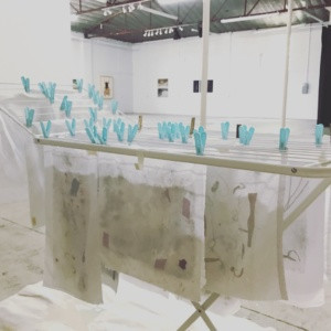 Paper hanging to dry, art class, handmade Papermaking class