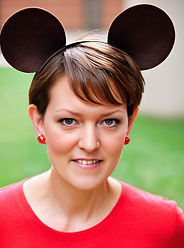 short_brown_hair_in_pixie_cut,_wearing_Micky_Mouse_ears_NO_BOW_ON_THEM,_wearing_red_shirt.