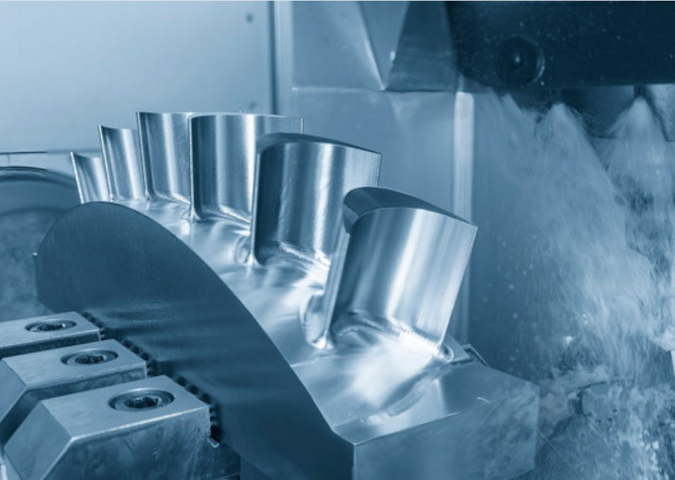 Prototype turbo stator fins being machined in a vertical 5 axis CNC mill