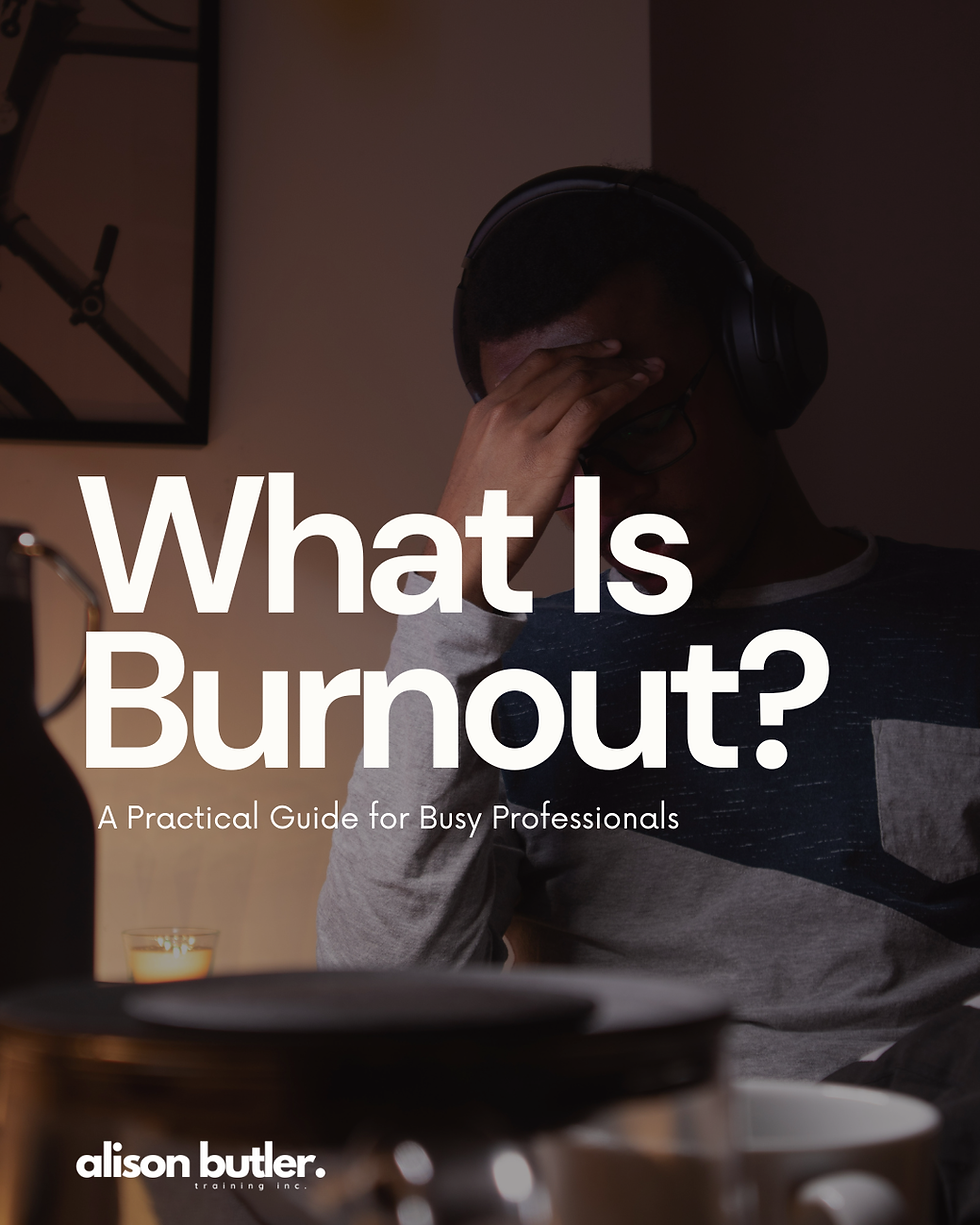 Person with headphones holding head, appearing stressed. Text: "What Is Burnout? A Practical Guide for Busy Professionals." Dimly lit room. Burnout at work