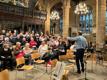 Conductor Thom Meredith rehearses the YPC in Wakefield Cathedral