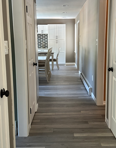Newly Renovated Hallway with Well put together new floor