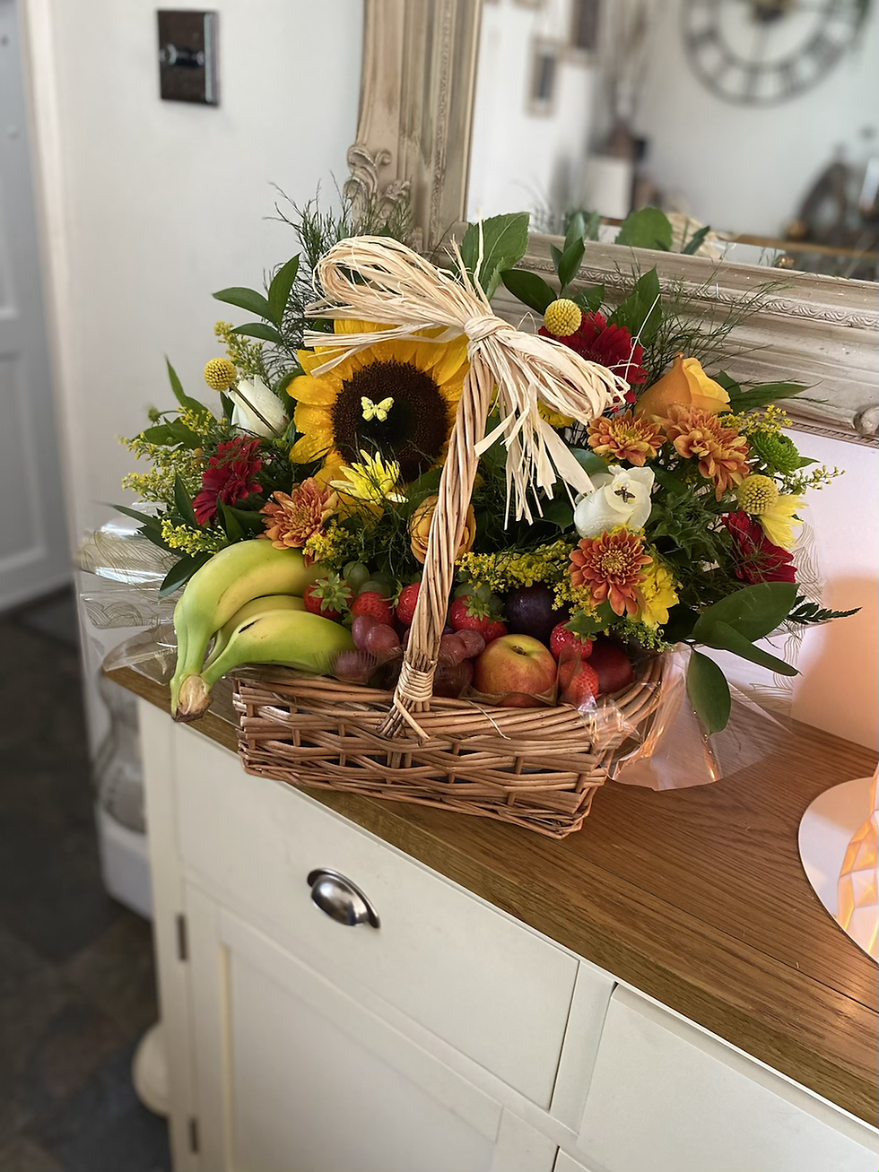 Thumbnail: Basket of fresh flowers and fresh fruit