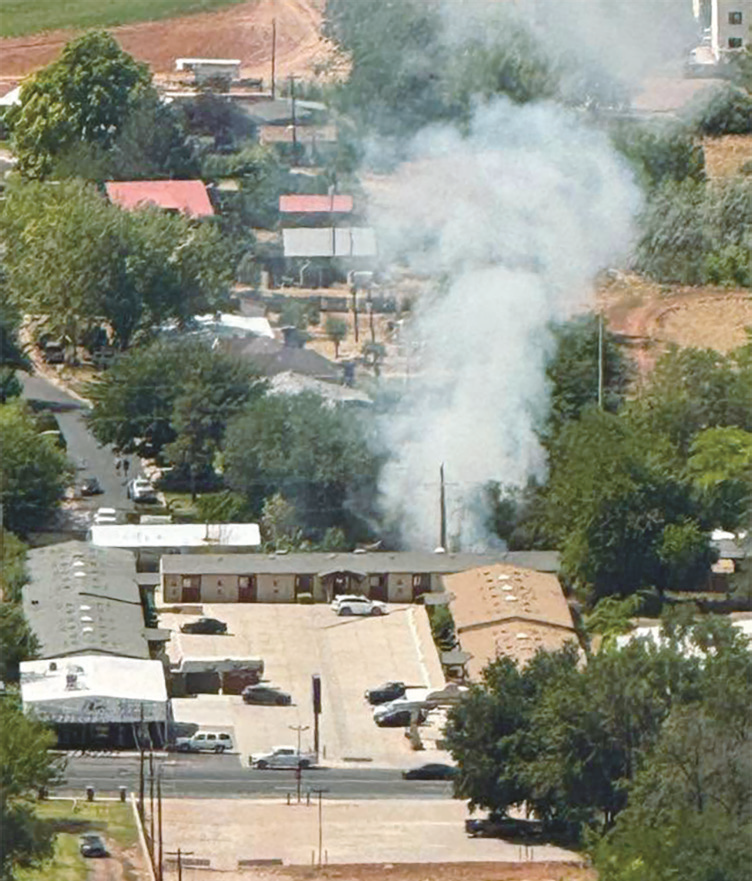 Quick response prevents backyard fire from spreading behind Travelodge July 5