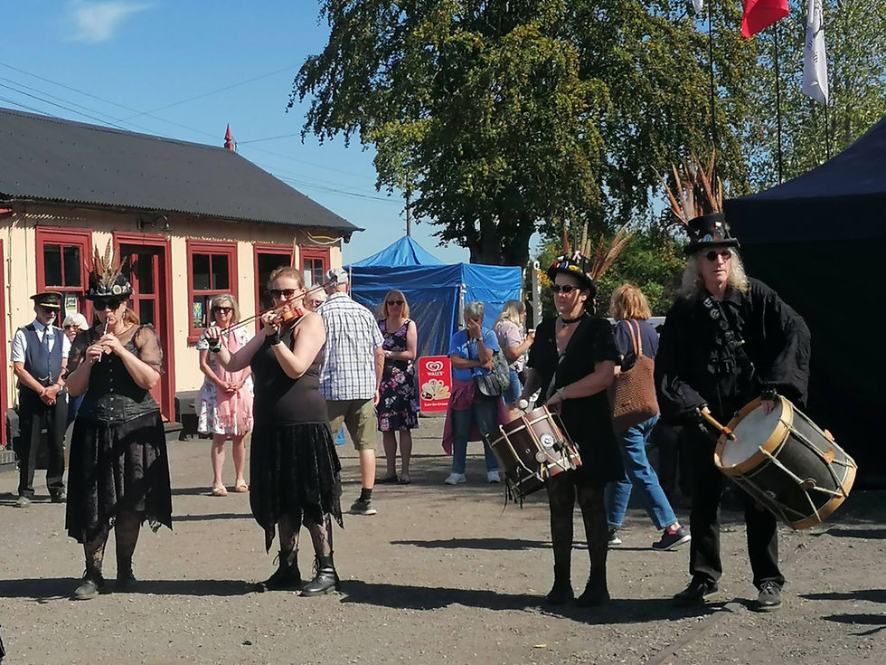 Wolf's Head & Vixen Goth Morris musicians at Bodiam Station