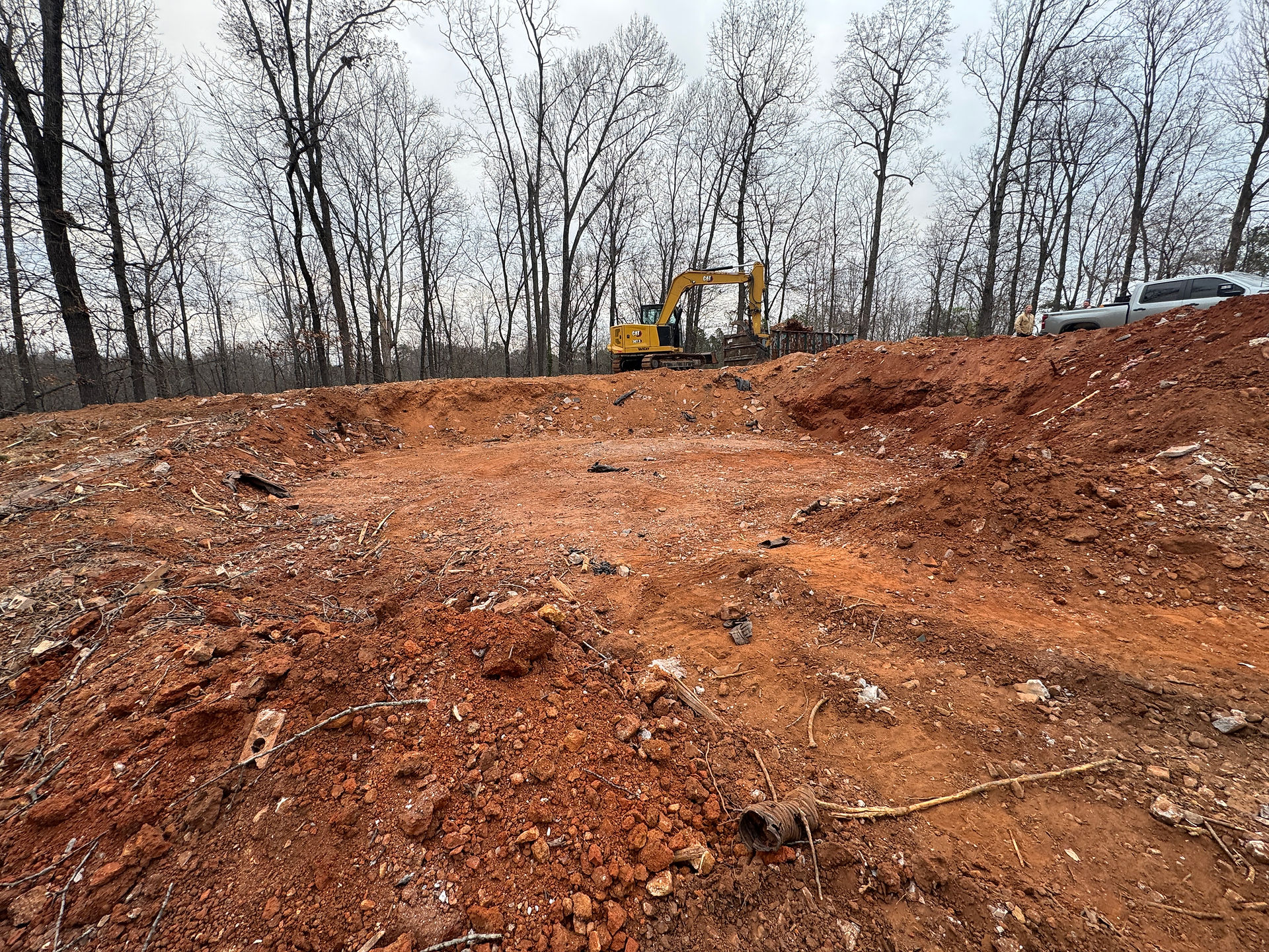 Demolished site in Acworth, Georgia, with excavator