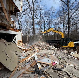 Demolished mobile home in Acworth, Georgia with excavator