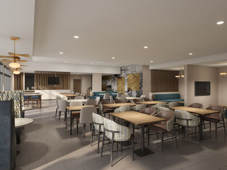 Empty modern dining room with wooden tables, patterned chairs, teal banquettes, and pendant lights under a soft-lit ceiling.