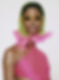 A fashion model wearing sunglasses and a pink bathing suit