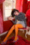 Style essence and style personality shown in a boldly dressed girl with red lipstick and orange tights.