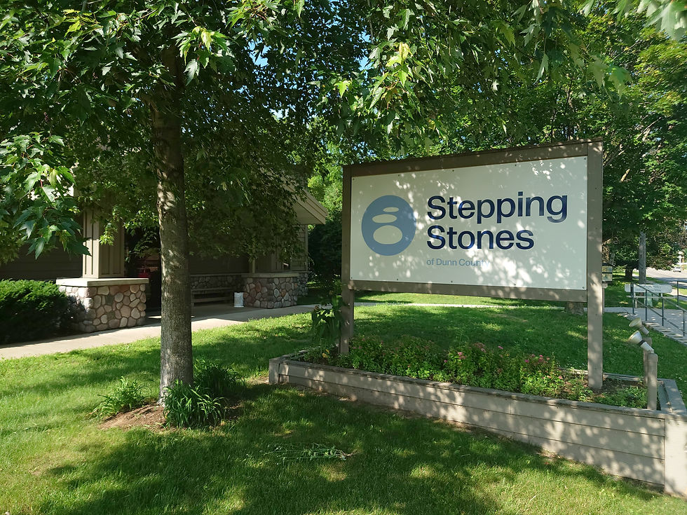 Eye-level view of community center entrance with welcoming signage