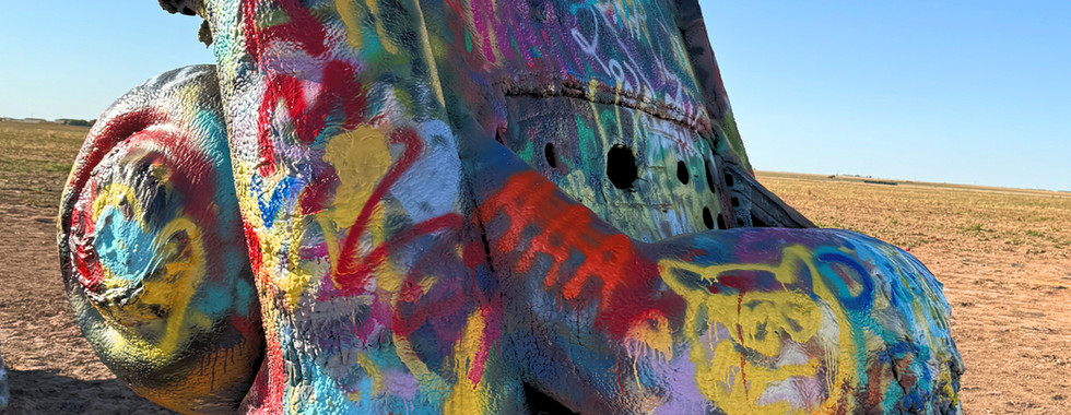Spray painted car at Cadillac Ranch in Texas
