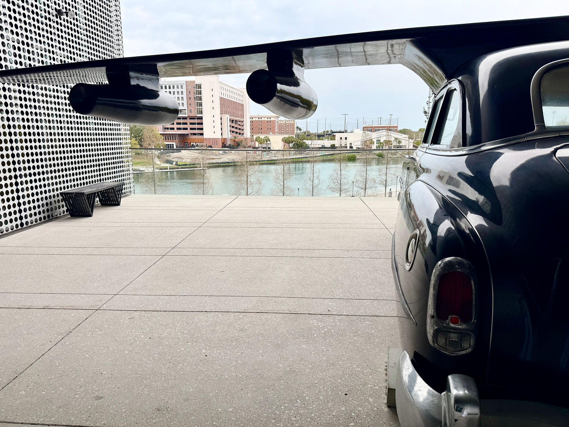 "Hybrid of Chrysler" sculpture by Esterio Segura at the Tampa Museum of Art with the Hillsbourough River in the background