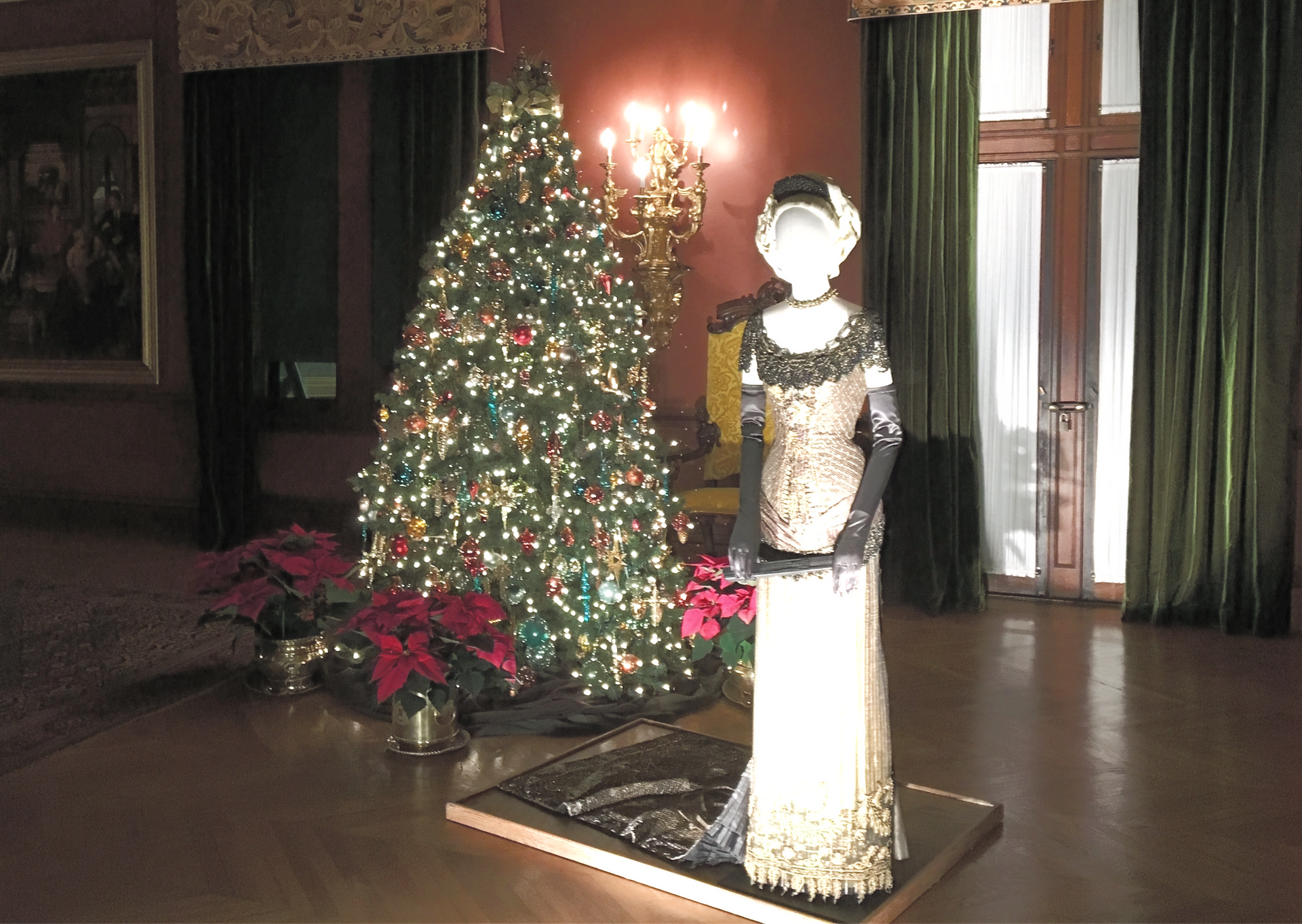 Vintage dress exhibited next to a Christmas tree at the Biltmore House