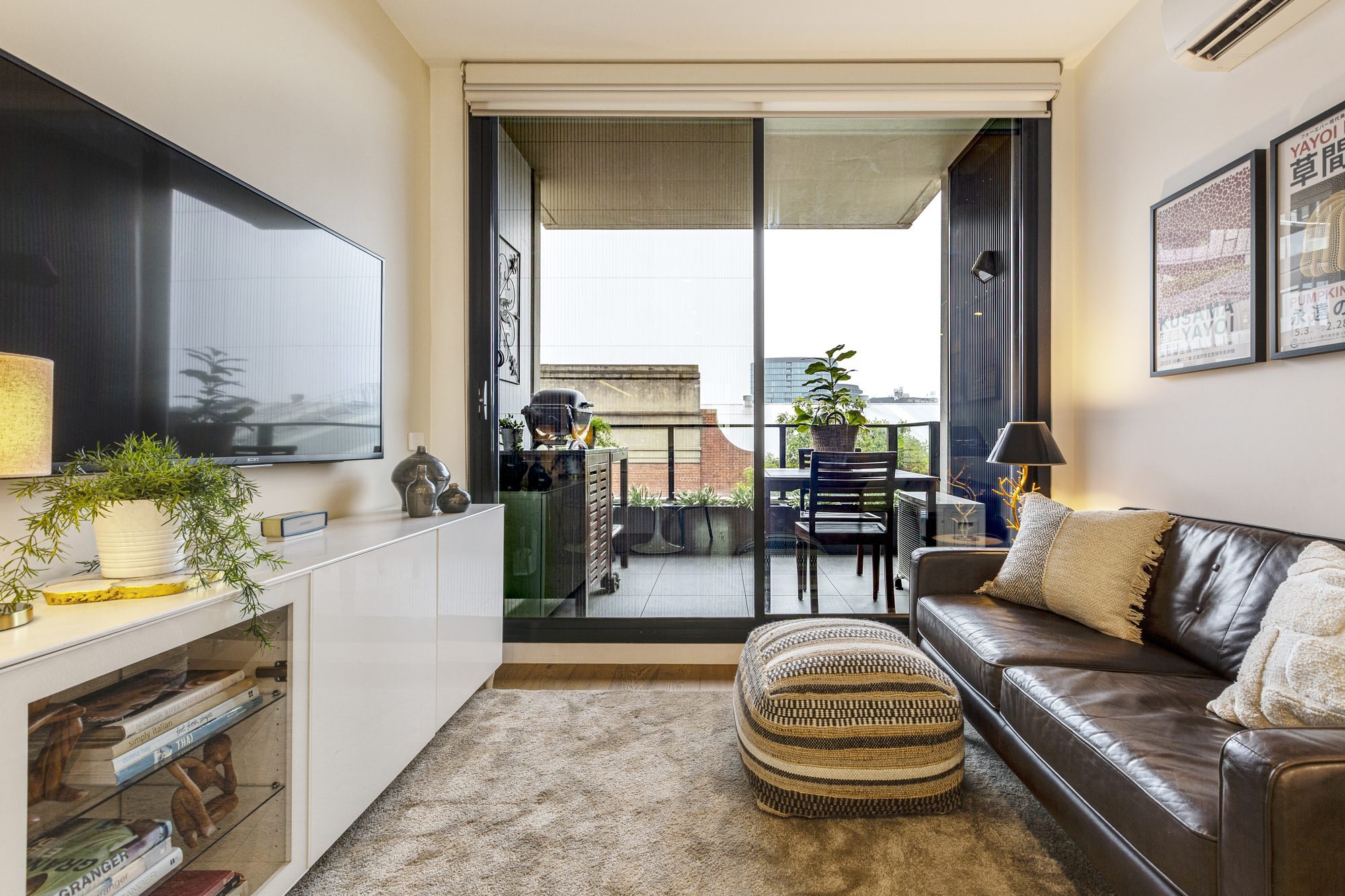 Apartment living room opening to a balcony