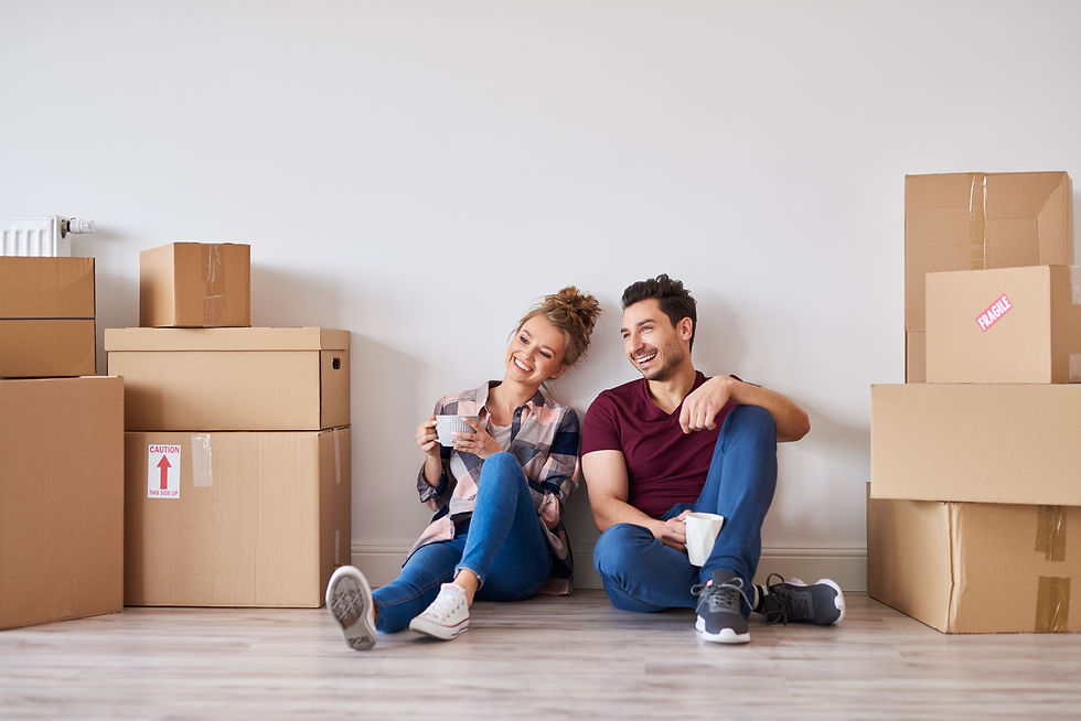 happy-couple-with-coffee-cups-relaxing-in-their-new-home.jpg
