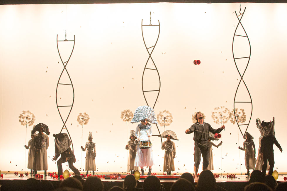 aerial silk performer mid-air, surreal costume under pink lighting