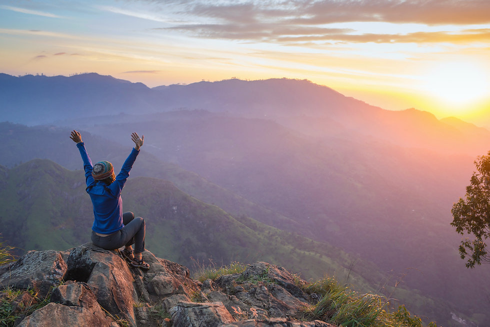 Woman on a mountain cliff (1).jpeg