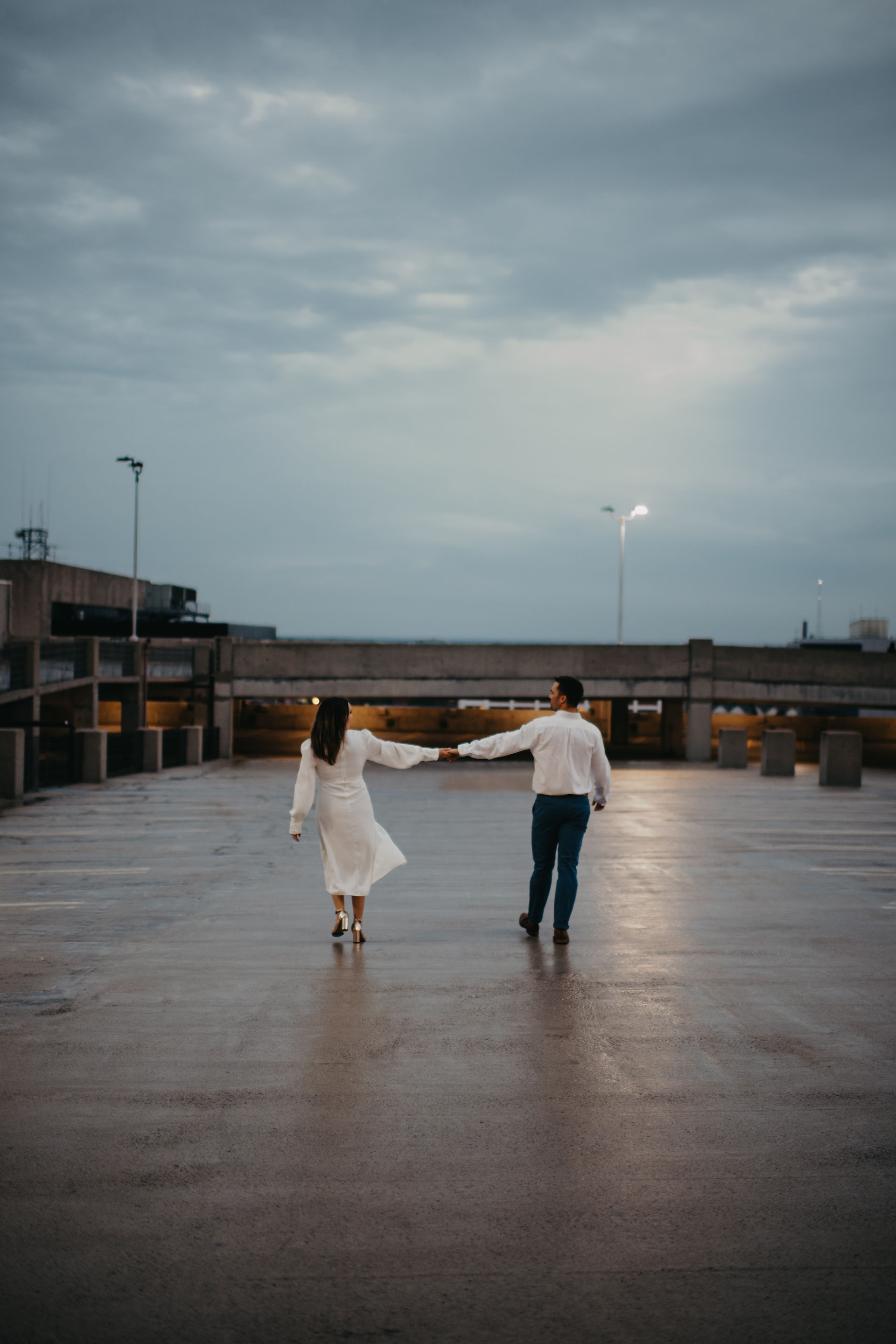 Couple dances on roof of parking garage for Engagement Photos in Buffalo 