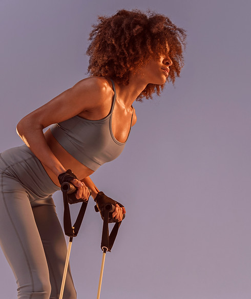 Woman Exercising with Resistance Bands_edited_edited.jpg