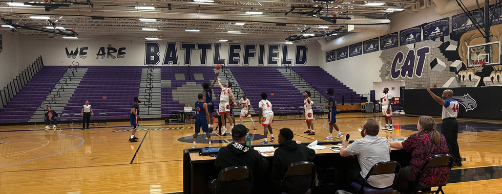 The opening tipoff of a DC Heat basketball game at Battlfefield High School