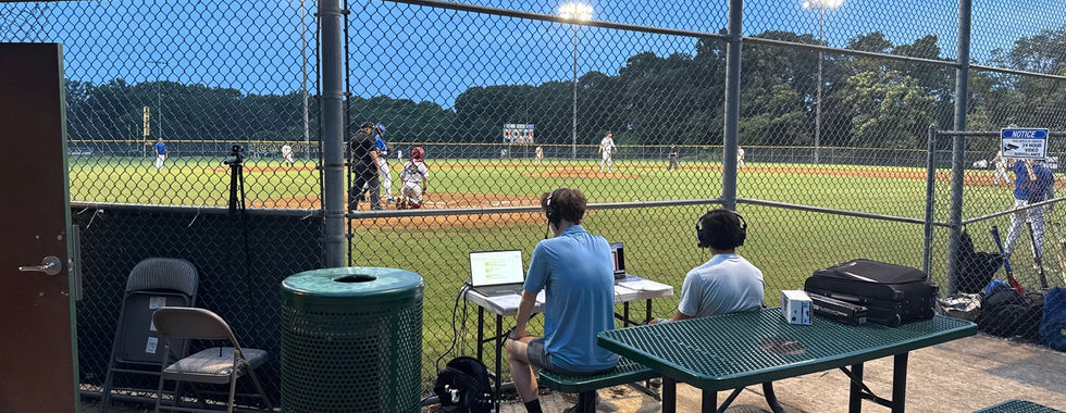 The view from behind home plate at a D.C. Grays baseball game at Woodbridge High School one evening.