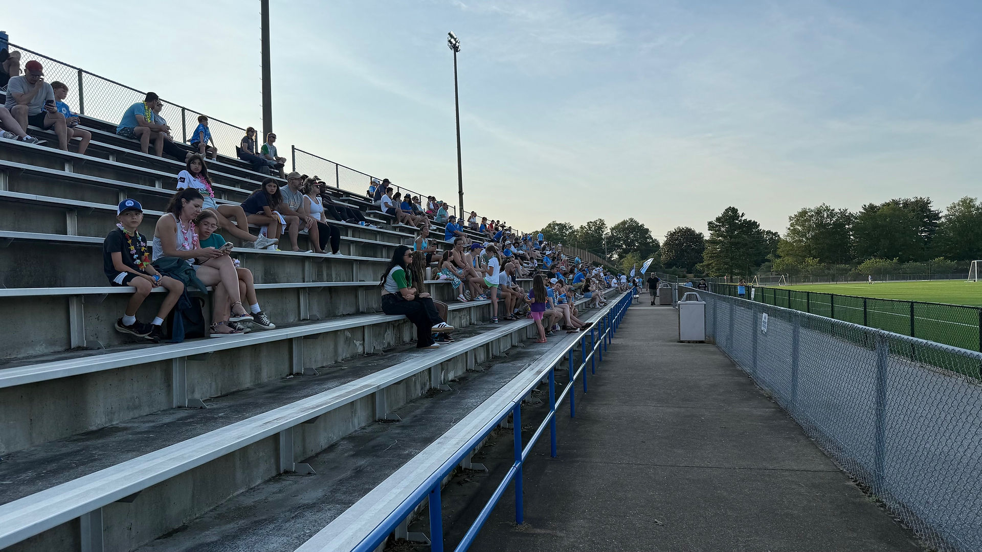 Fans in the bleachers at Siegert Field during a Patuxent FA game