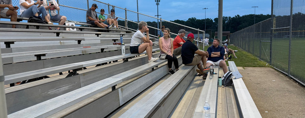 Fans in the stands at a D.C. Grays baseball game at Woodbridge High School