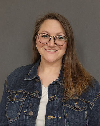 Picture of smiling woman with long dark hair and glasses
