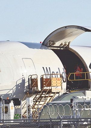 cargo-plane-being-loaded-to-deliver-packages-acros-2023-11-27-04-52-49-utc.jpg
