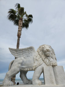 A Greek griffin statue on the Larnaca beach