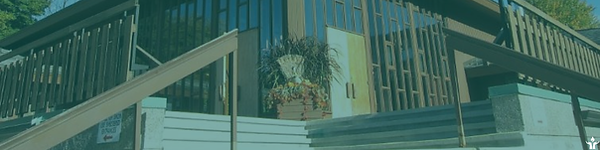 FirstU's huge double front doors, as viewed from the foot of the exterior steps.
