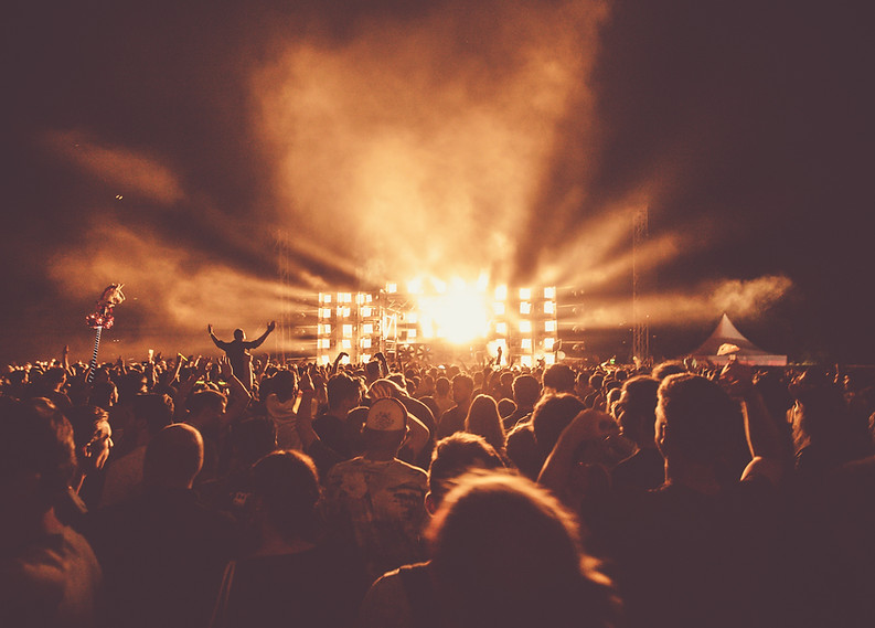 Live concert venue with crowd watching