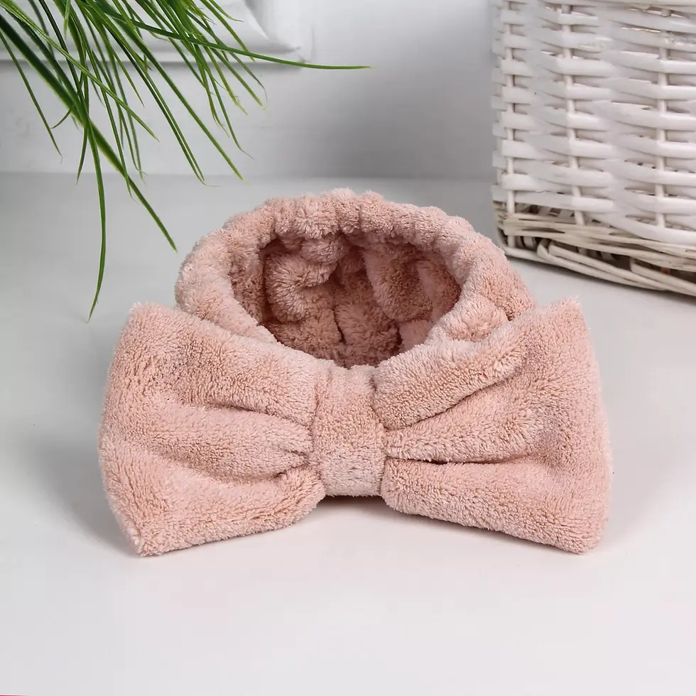 Thumbnail: Pink terry cloth headband in a bow shape. Mellofina's best seller.