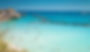 mare di otranto con persone che nuotano e scogli
