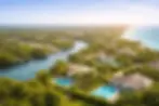 Aerial view of luxury waterfront homes with swimming pools in a tropical South Florida nei