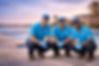 Dolphin Pool Leak Inspection team posing beside a luxury residential swimming pool
