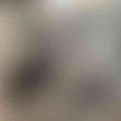 People gather at a groundbreaking ceremony, smiling and holding shovels. The setting is outdoors; a newspaper clipping date is visible.