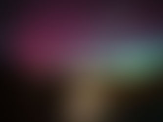 Stone chapel illuminated at night, surrounded by trees and grass. Aurora borealis in sky with red and green hues. Reflective water in foreground.