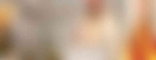 A bishop gestures while preaching from the pulpit during Mass inside a cathedral.