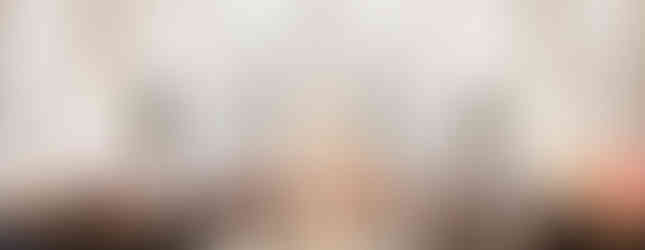 A congregation gathers in a grand, ornate church. Priests in robes conduct a ceremony near an intricately detailed altar. Moods of reverence prevail.