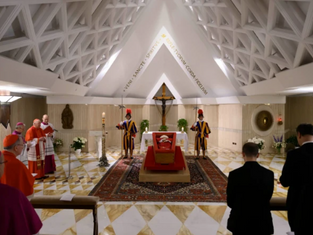 Priests and guards stand by a coffin in a chapel with a triangular ceiling. The scene is solemn with red, gold, and white colors present.