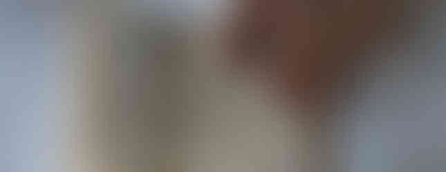 A hand with rings points to a tattered prayer book on a lace tablecloth. Text includes "Prayers before Confession" and a communion record.