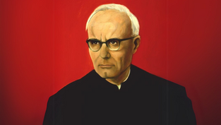Portrait of an elderly man with glasses wearing dark clothing against a vivid red background, expressing a serious demeanor.