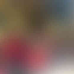 A group of children in red and navy uniforms sit attentively on church steps, listening to a standing man. Stained glass windows in background.